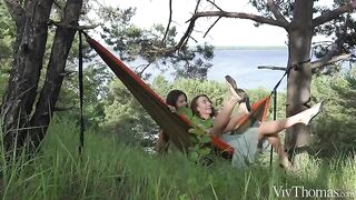 A girl gets a tan in a sensitive spot from a brunette