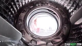 A girl was helped by a guy with a vibrating washing machine