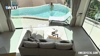A beautiful woman enjoys her vacation alone in the swimming pool