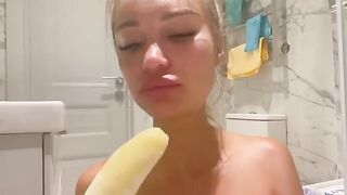 Girl masturbates with a banana, imitating porn stars in hot scenes
