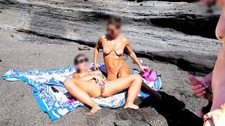 A girl has an erotic massage while her friend jerks off