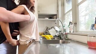 A hot brunette MILF is getting fucked in the kitchen