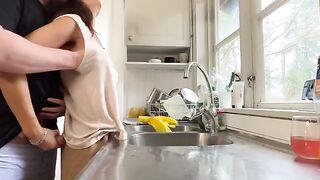 A hot brunette MILF is getting fucked in the kitchen
