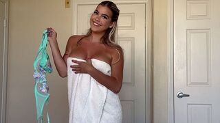 A stepmom is stripping like a candy wrapper, showcasing her curvy charm in a steamy scene