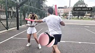 A girl is having a hard workout with her personal trainer, showing her athletic body