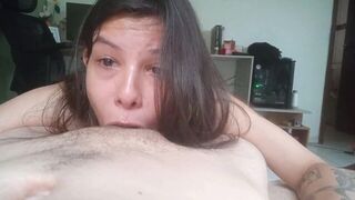 A girl has sex with her head thrown back, moaning intensely