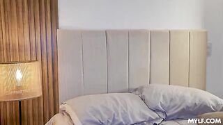 A blonde in a passionate cowgirl on the bed, completely forgotten about shame